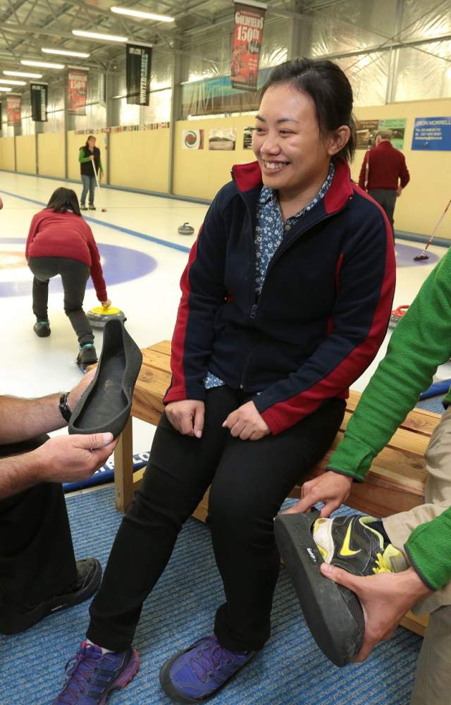 Curling in Naseby fitting safe shoe covers for on the ice