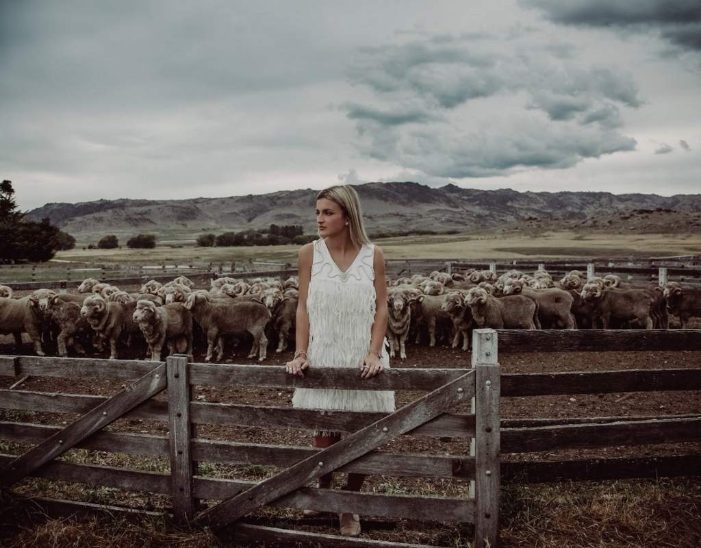 woolon Event Fashion Garments  white dress in sheep yards Photographer Lisa Davidson